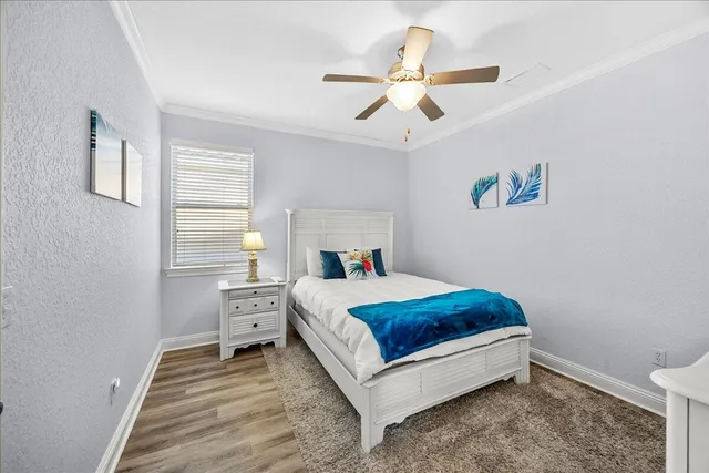 a room with a bed and a chandelier