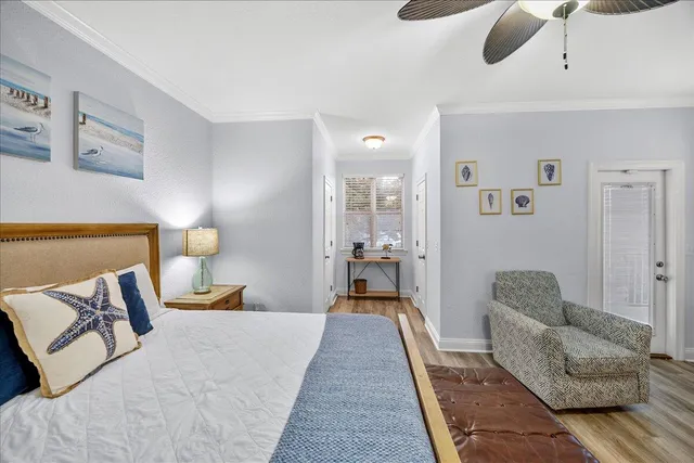 a bedroom with a bed couch and window