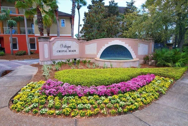 a view of a back yard with flower garden