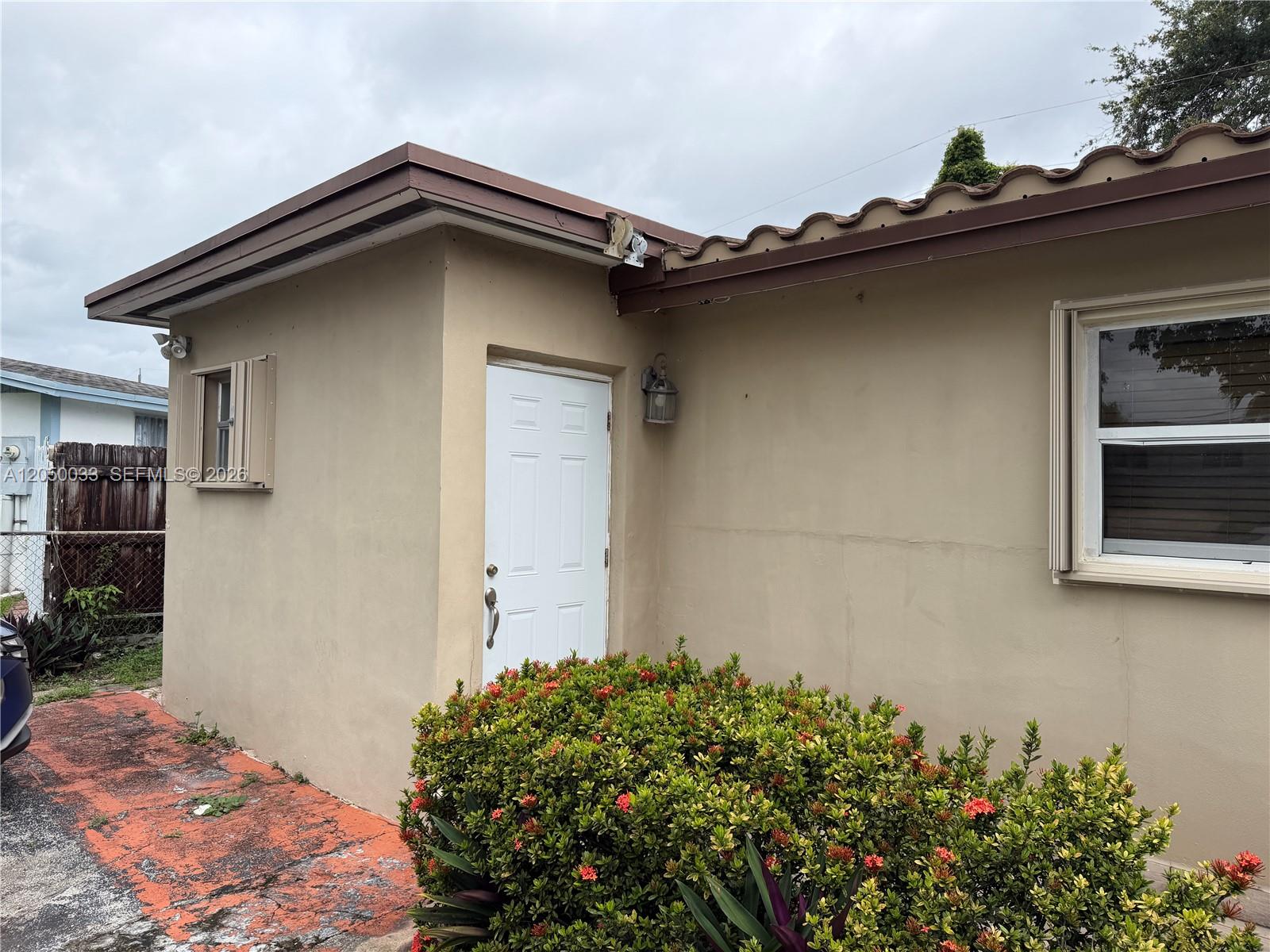 7889 Northwest 174th Street, Unit STUDIO Hialeah, FL 33015 - Photo 9 of 9 Left side of the house