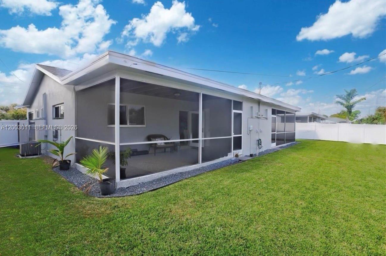 2550 North Dixie Highway, Unit 2570 Boca Raton, FL 33431 - Photo 15 of 16 a view of an house with backyard and entertaining space