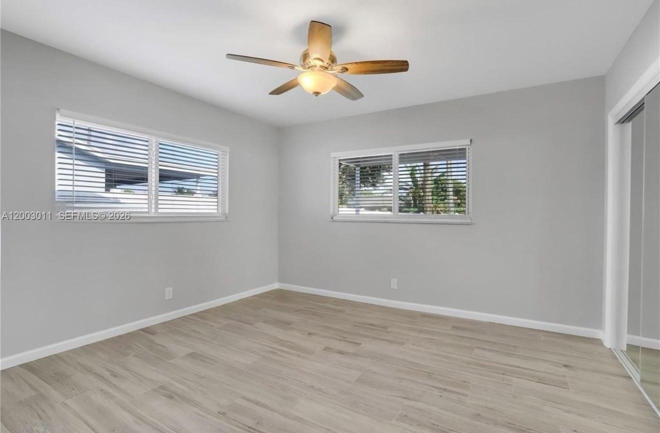 2550 North Dixie Highway, Unit 2570 Boca Raton, FL 33431 - Photo 9 of 16 a view of empty room with wooden floor and fan