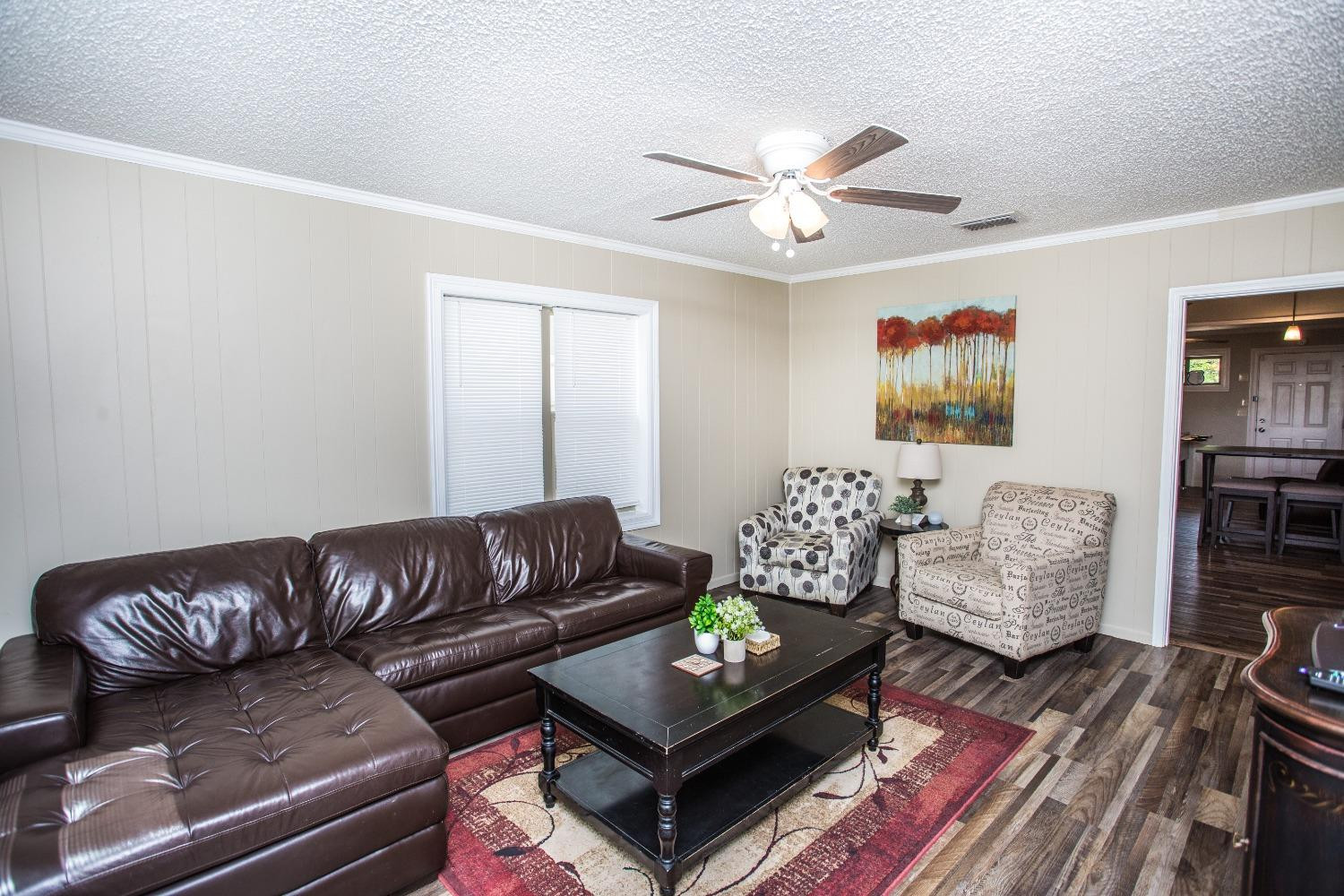 2418 23rd Street Lubbock, TX 79411 - Photo 4 of 17 a living room with furniture and a couch