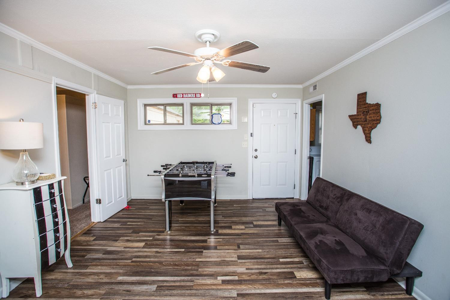 2418 23rd Street Lubbock, TX 79411 - Photo 7 of 17 a living room with furniture