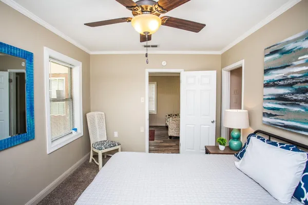 a bedroom with a bed and a window