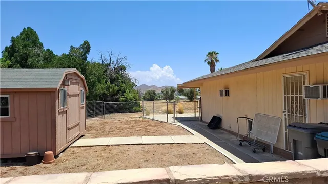 a view of a back yard of the house