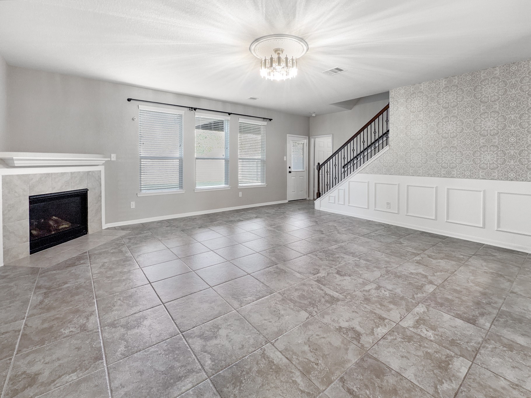 2269 Garden Square Path Spring, TX 77386 - Photo 3 of 18 a view of an empty room with a fireplace and a window