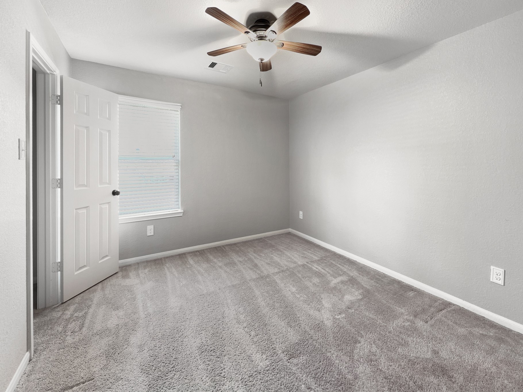 2269 Garden Square Path Spring, TX 77386 - Photo 4 of 18 an empty room with fan and windows