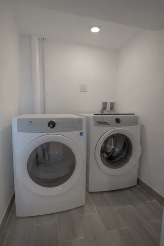 a utility room with dryer and washer