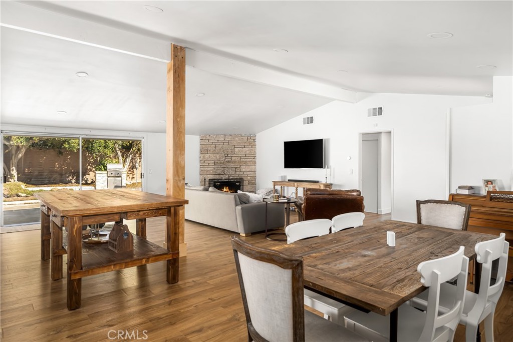 448 Princeton Drive Costa Mesa, CA 92626 - Photo 14 of 33 a living room with stainless steel appliances kitchen island granite countertop furniture and a flat screen tv