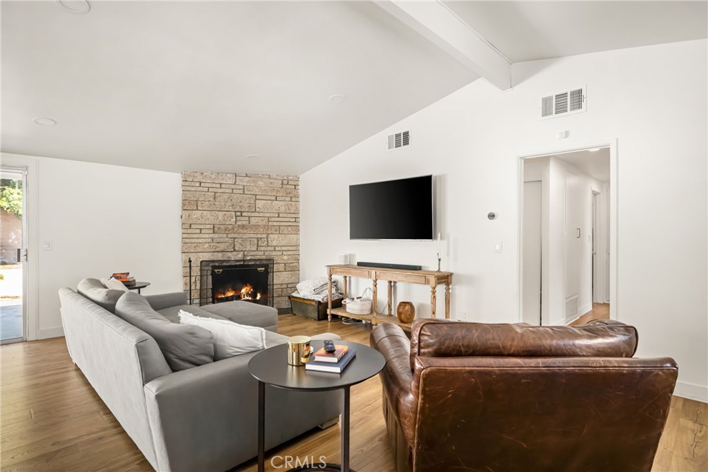 448 Princeton Drive Costa Mesa, CA 92626 - Photo 16 of 33 a living room with furniture and a flat screen tv
