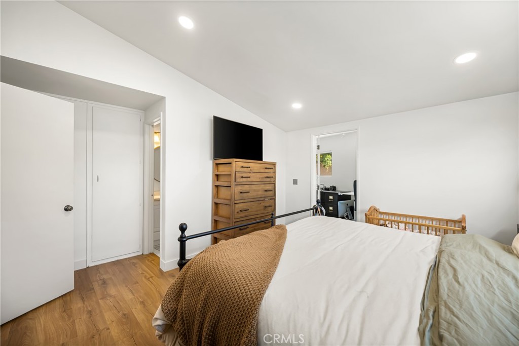 448 Princeton Drive Costa Mesa, CA 92626 - Photo 24 of 33 a bedroom with a bed and a television