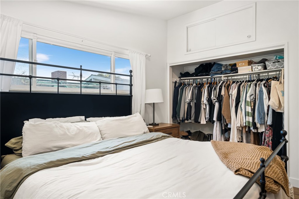 448 Princeton Drive Costa Mesa, CA 92626 - Photo 25 of 33 a bedroom with a bed and a closet