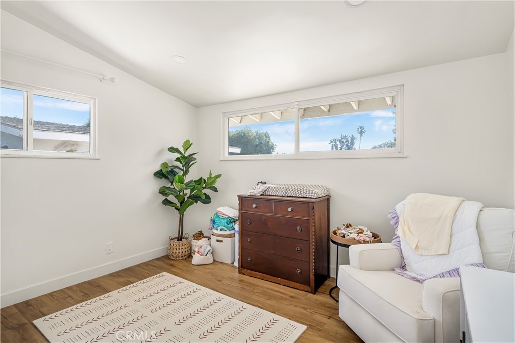 448 Princeton Drive Costa Mesa, CA 92626 - Photo 28 of 33 a living room with furniture and a potted plant