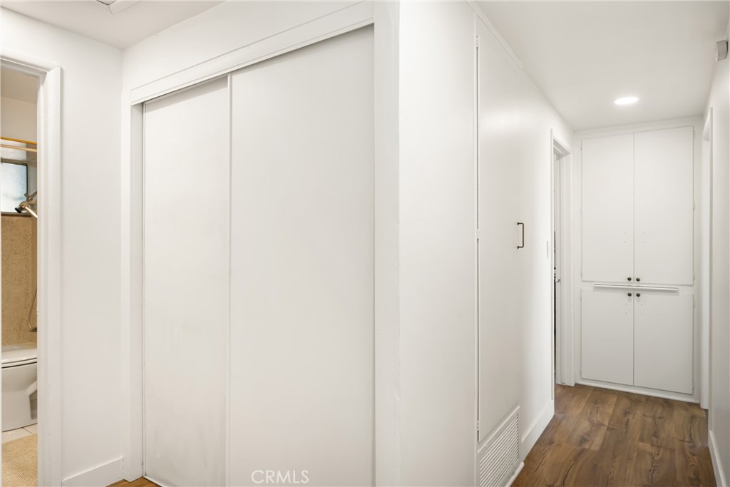 448 Princeton Drive Costa Mesa, CA 92626 - Photo 29 of 33 a view of a hallway with wooden floor