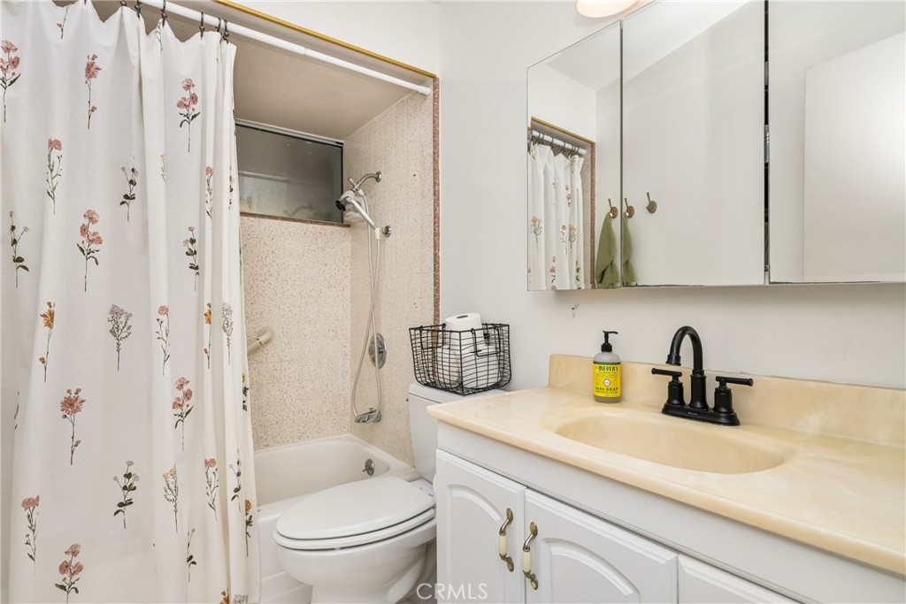 448 Princeton Drive Costa Mesa, CA 92626 - Photo 30 of 33 a bathroom with a sink a toilet and shower