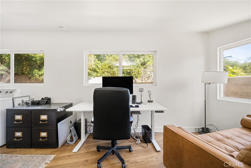 448 Princeton Drive Costa Mesa, CA 92626 - Photo 31 of 33 a living room with furniture and a window