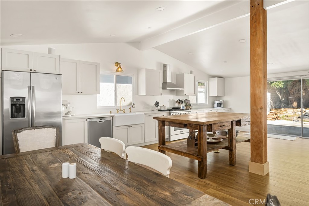 448 Princeton Drive Costa Mesa, CA 92626 - Photo 5 of 33 a kitchen with white cabinets and counter space