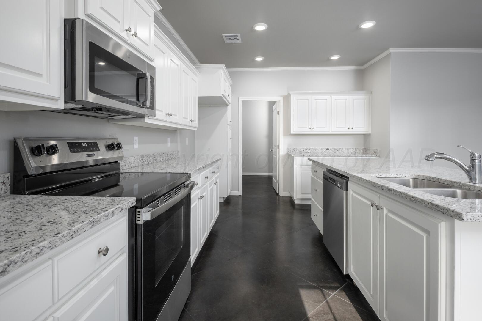 4600 Richardson Road Amarillo, TX 79118 - Photo 12 of 29 a kitchen with stainless steel appliances granite countertop a sink stove and cabinets