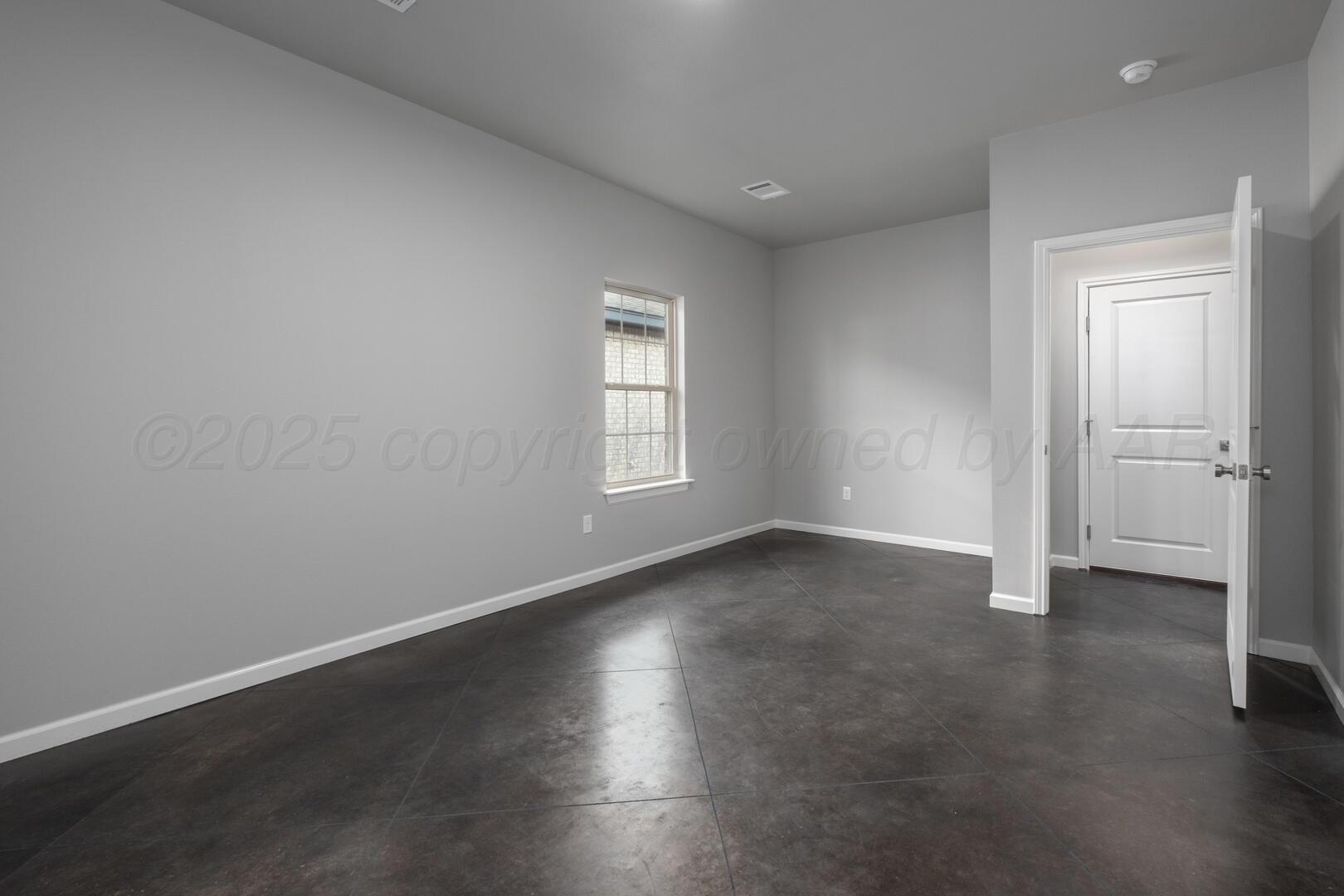 4600 Richardson Road Amarillo, TX 79118 - Photo 16 of 29 an empty room with wooden floor and window