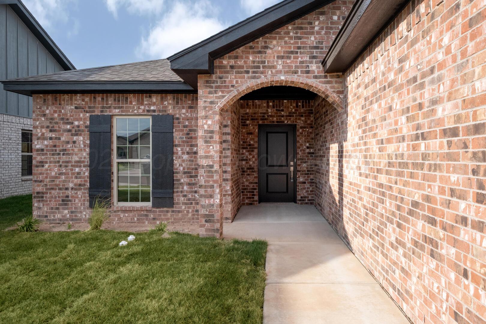 4600 Richardson Road Amarillo, TX 79118 - Photo 2 of 29 a front view of a house with a garden