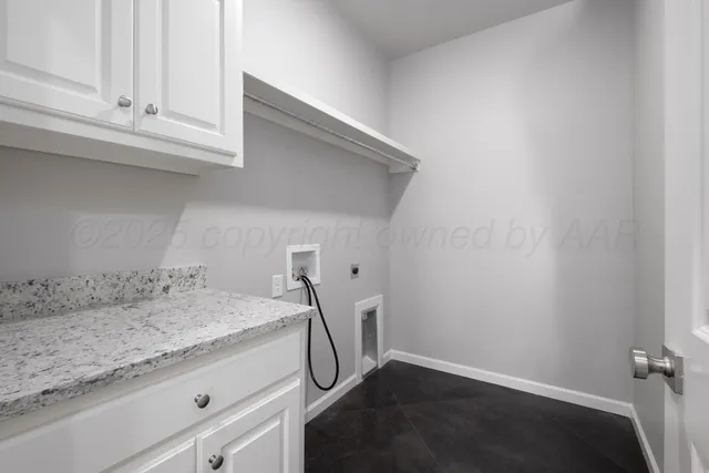 a room with a sink and cabinets