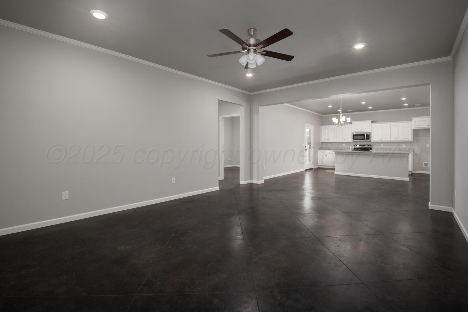 4600 Richardson Road Amarillo, TX 79118 - Photo 8 of 29 wooden floor in an empty room with a kitchen