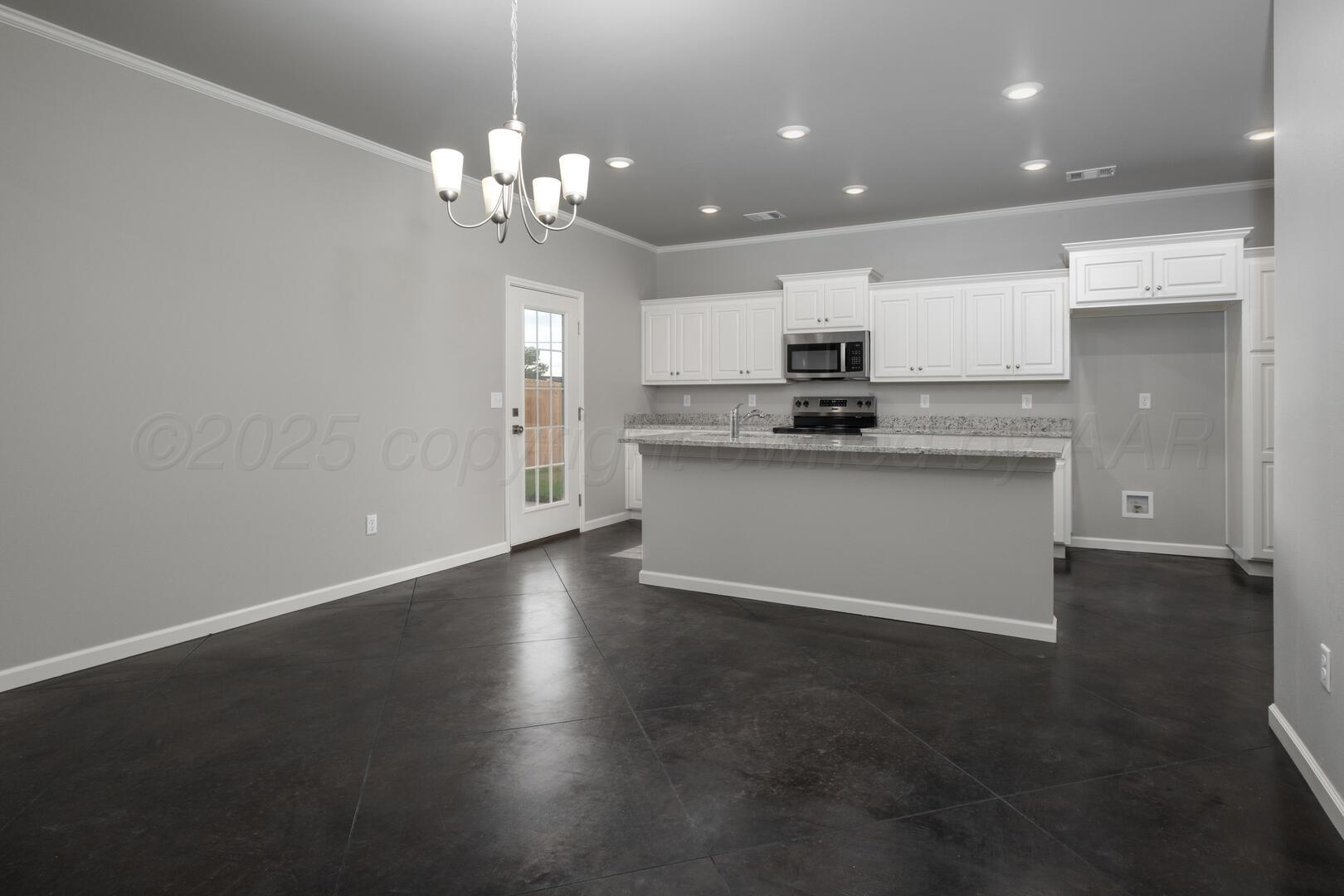4600 Richardson Road Amarillo, TX 79118 - Photo 10 of 29 a kitchen with kitchen island stainless steel appliances a sink stove and cabinets
