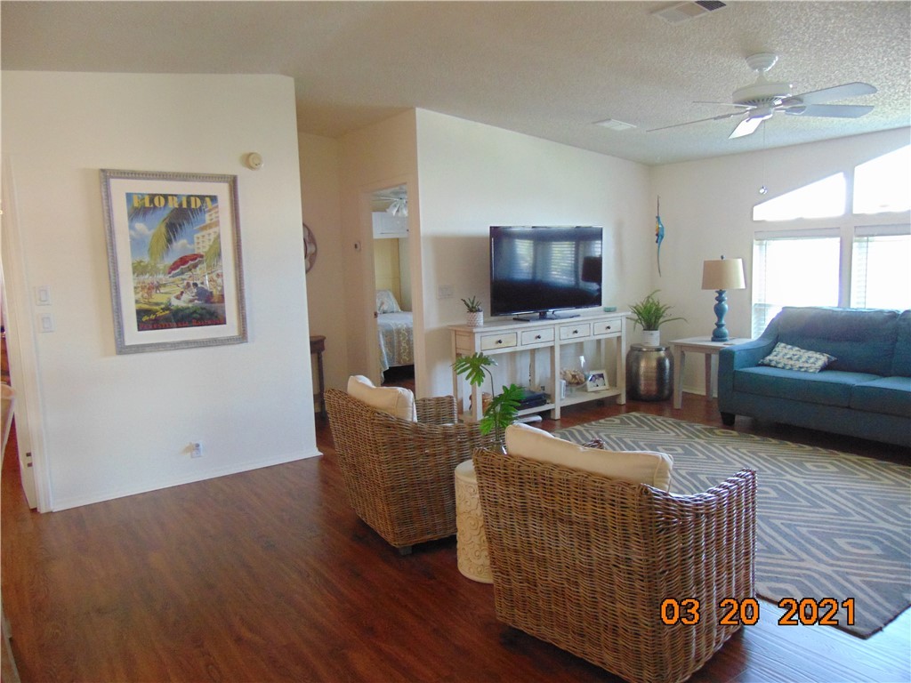 7615 Montauk Avenue, Unit R9 Micco, FL 32976 - Photo 17 of 36 a living room with furniture and a flat screen tv