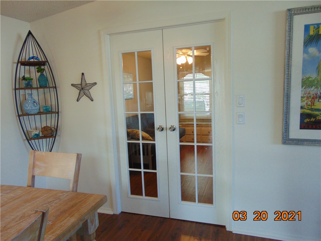7615 Montauk Avenue, Unit R9 Micco, FL 32976 - Photo 18 of 36 a view of a livingroom with furniture and wooden floor