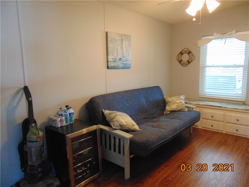 7615 Montauk Avenue, Unit R9 Micco, FL 32976 - Photo 20 of 36 a living room with furniture and a window