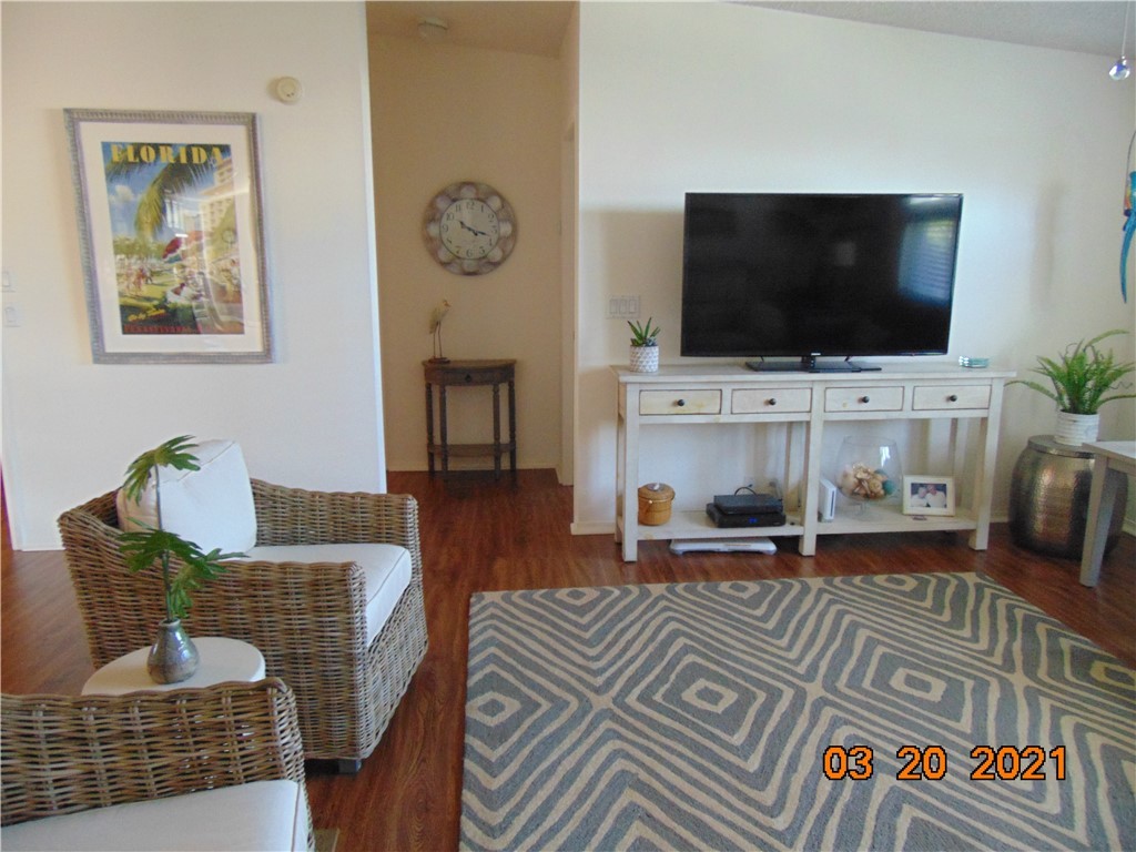 7615 Montauk Avenue, Unit R9 Micco, FL 32976 - Photo 21 of 36 a living room with furniture and a flat screen tv