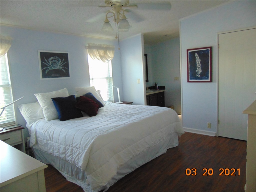 7615 Montauk Avenue, Unit R9 Micco, FL 32976 - Photo 24 of 36 a bedroom with a bed and a window