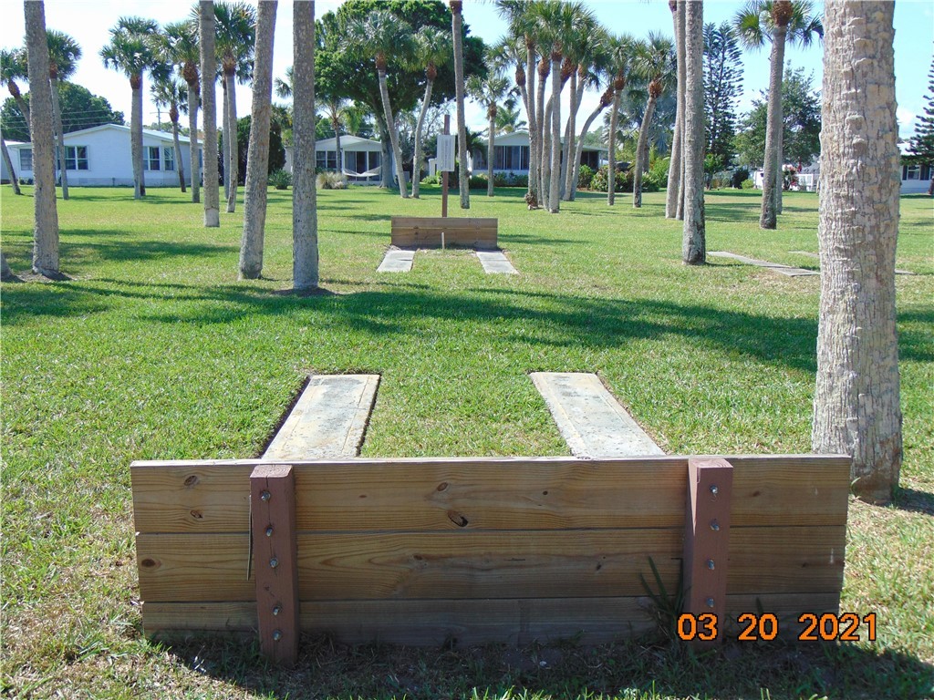 7615 Montauk Avenue, Unit R9 Micco, FL 32976 - Photo 28 of 36 a view of a bench in a park