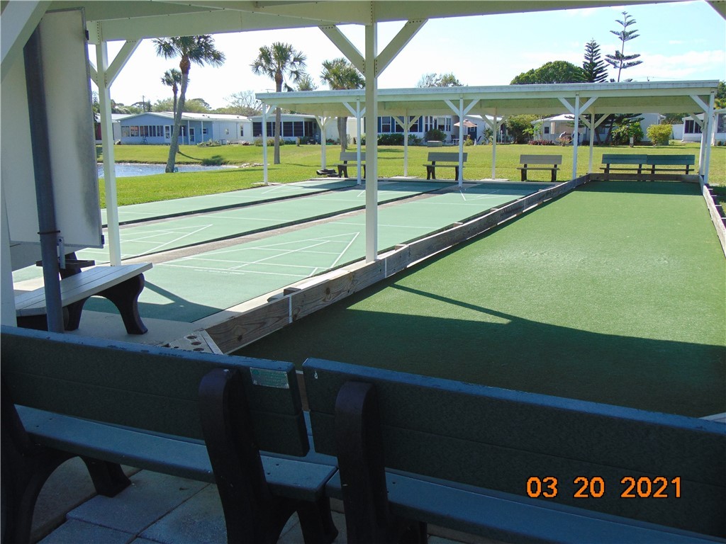 7615 Montauk Avenue, Unit R9 Micco, FL 32976 - Photo 29 of 36 a view of an outdoor space and yard