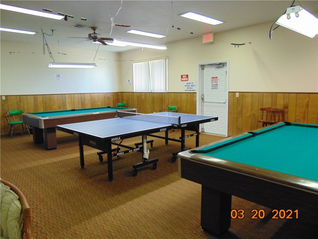 7615 Montauk Avenue, Unit R9 Micco, FL 32976 - Photo 31 of 36 a room with furniture and a pool table