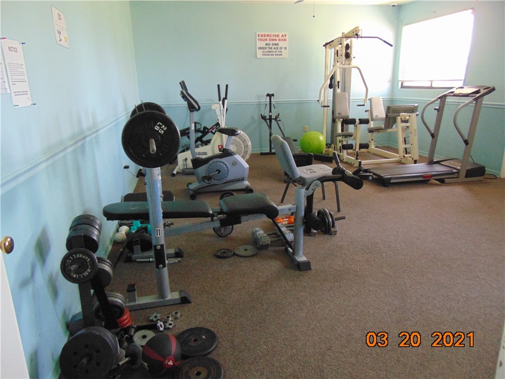 7615 Montauk Avenue, Unit R9 Micco, FL 32976 - Photo 32 of 36 a view of a room with gym equipment