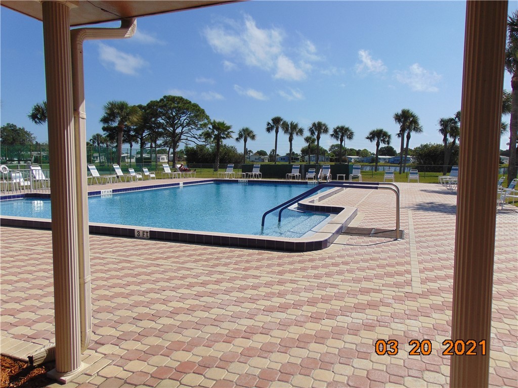 7615 Montauk Avenue, Unit R9 Micco, FL 32976 - Photo 34 of 36 a view of swimming pool from a balcony
