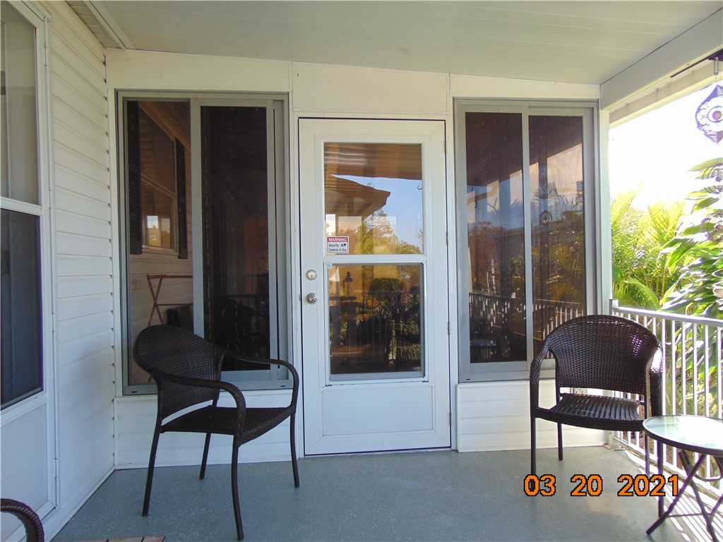7615 Montauk Avenue, Unit R9 Micco, FL 32976 - Photo 6 of 36 a living room with furniture and a window