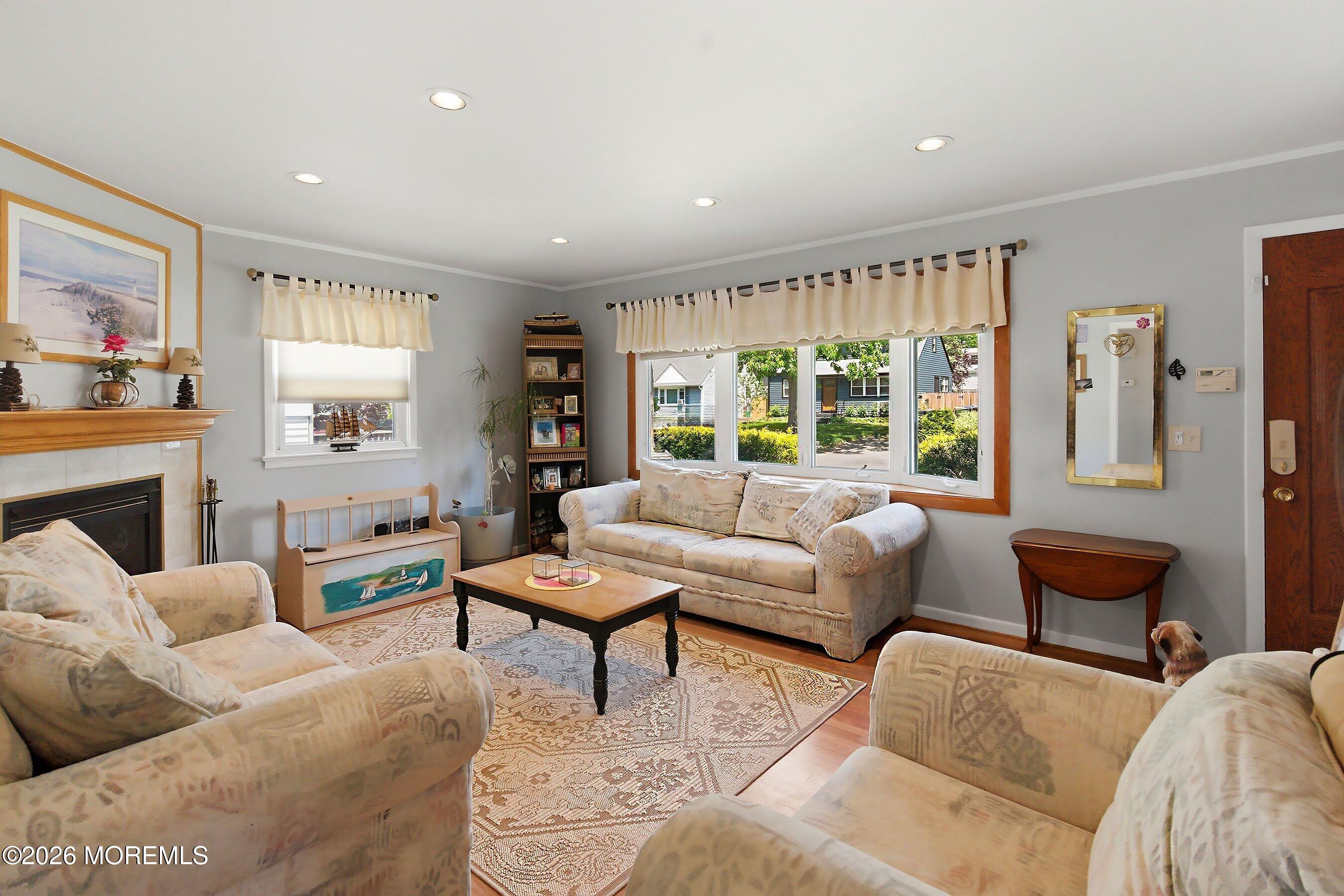 412 Moore Road Neptune Township, NJ 07753 - Photo 5 of 36 a living room with furniture and a large window