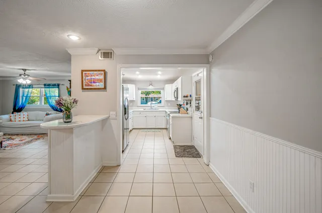 a kitchen with a sink a counter top space and cabinets