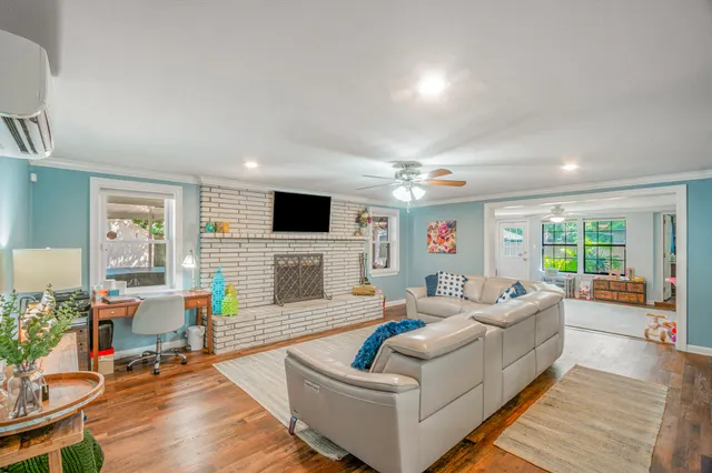 a living room with furniture and a flat screen tv