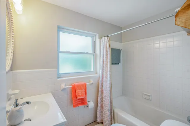 a bathroom with a sink and a bathtub