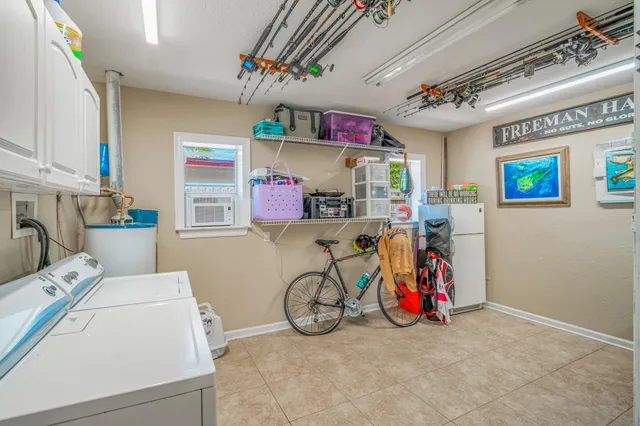 a view of storage and utility room with washer and dryer