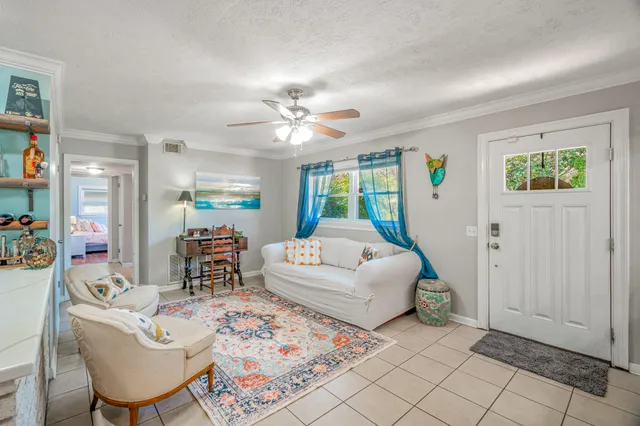 a living room with furniture and a table