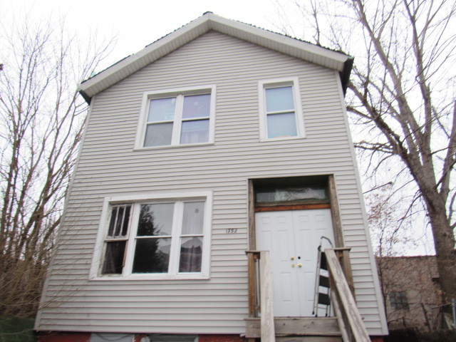1752 West Cullerton Street Chicago, IL 60608 - Photo 2 of 31 a front view of a house with balcony