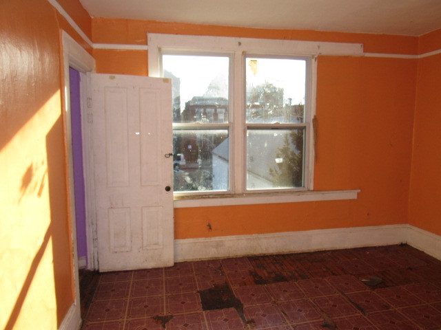 1752 West Cullerton Street Chicago, IL 60608 - Photo 16 of 31 a view of a door and wooden floor in a living room