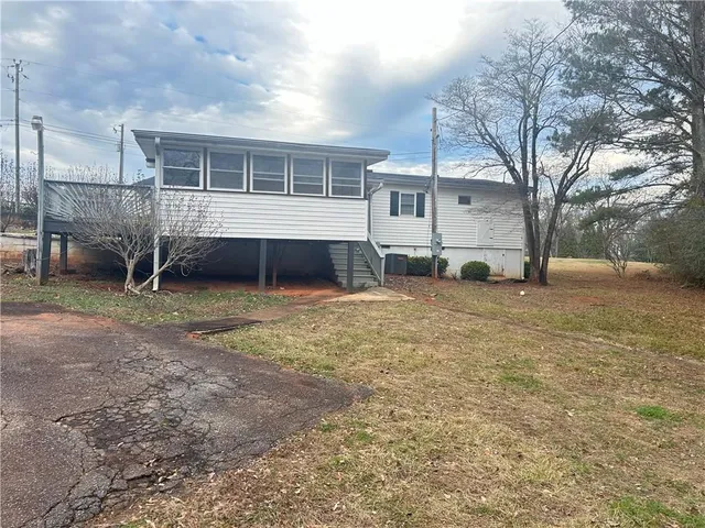 a house view with a backyard space