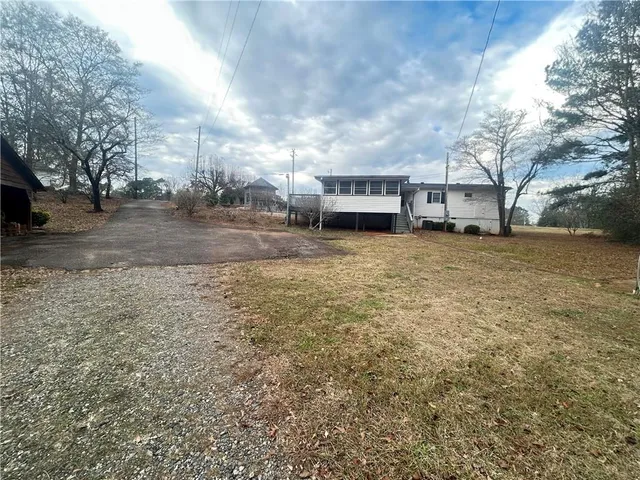 a view of a town with large trees