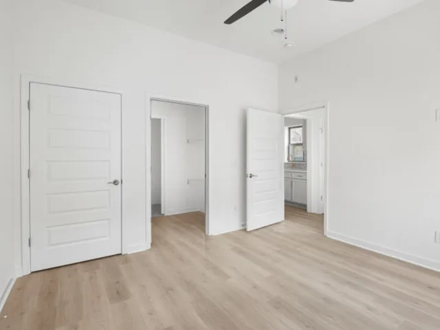 an empty room with closet area
